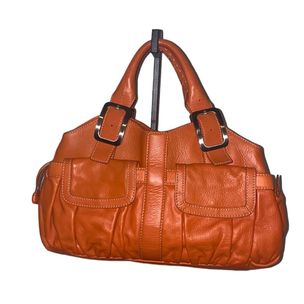 Orange Cole Haan shoulder bag.